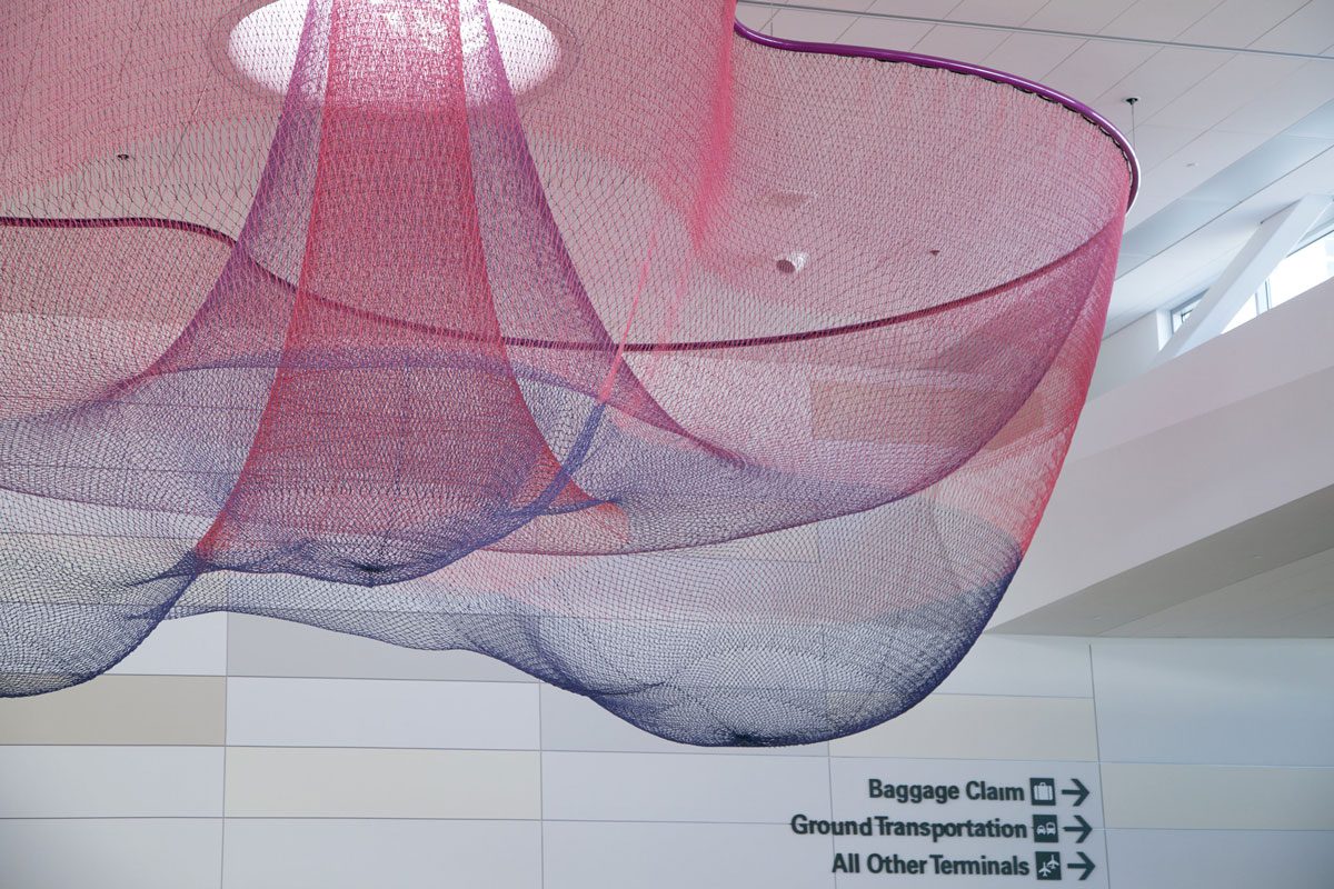 MASSIVart's Guide to Creative Placemaking - Enhancing Travel Through Design - Image of San Francisco Airport and Janet Echelman art installation